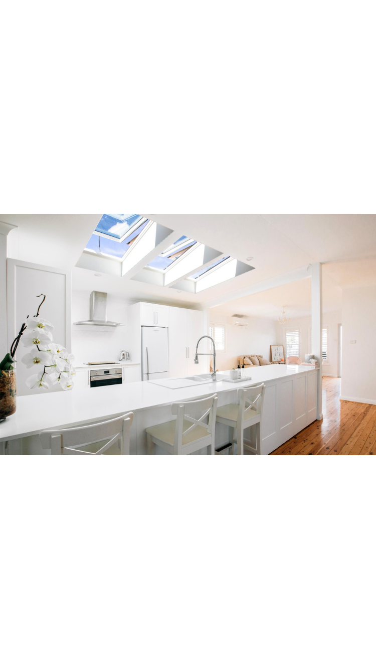 opening skylights over white kitchen