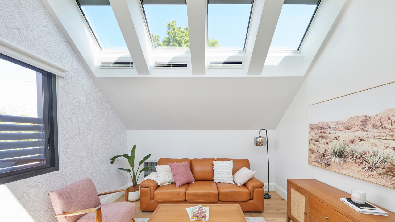 4 VELUX skylights over living room pink