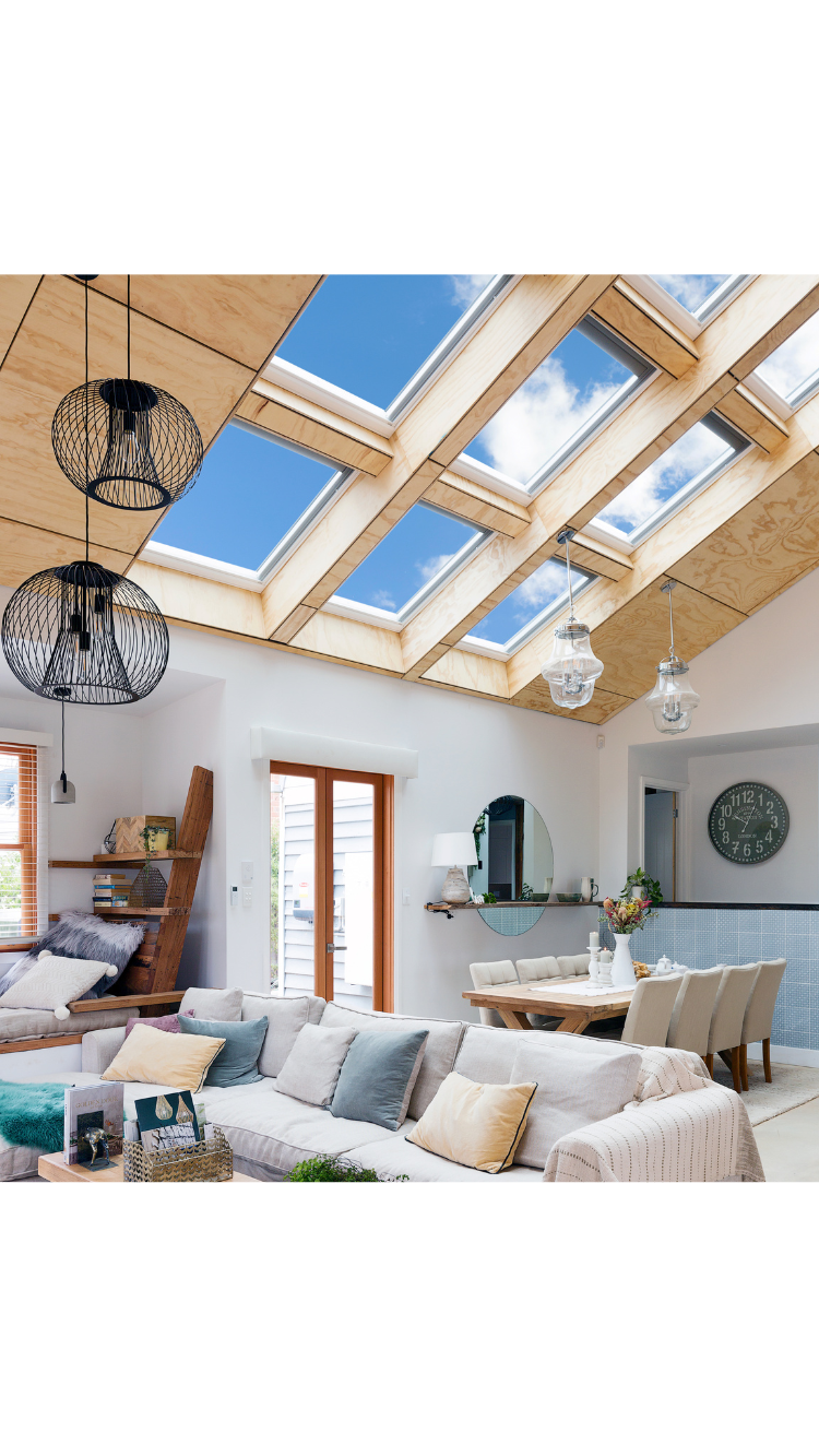 bank of skylights wooden ceiling in living room