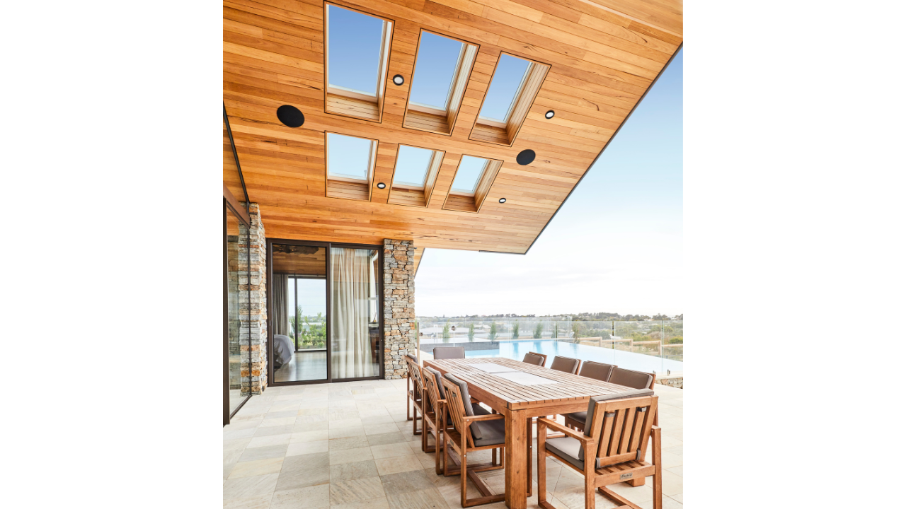 multiple skylights over wooden patio ceiling